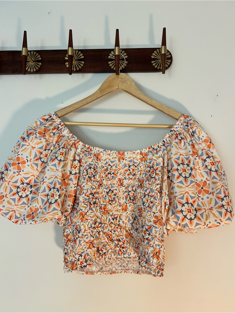 Anthropologie White Smocked Top with Peach, Navy & Gold Print